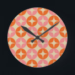 Pink and Orange Mid Century Mod Geometric Pattern Round Clock<br><div class="desc">A colorful groovy 1960s style mid century modern geometric shapes pattern in bright pink and orange.</div>