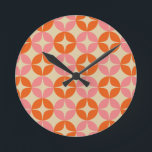 Pink and Orange Mid Century Mod Geometric Pattern Round Clock<br><div class="desc">A colorful groovy 1960s style mid century modern geometric shapes pattern in bright pink and orange.</div>