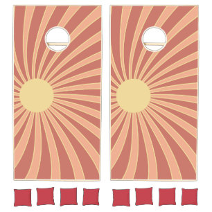Pink and orange retro style sunburst design cornhole set