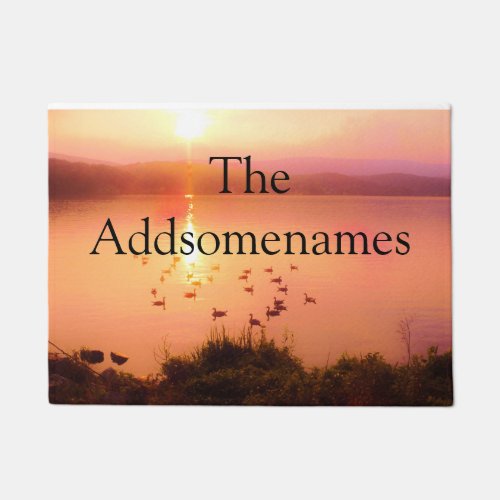 Pink and peach lake sunset Family Name Doormat