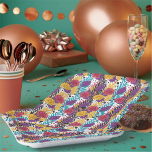 Pink and purple cut flowers with intricate petals  paper plates