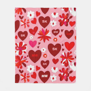 Pink and red hearts and flowers motif and initials fleece blanket