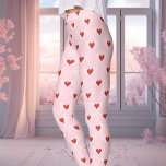 Pink And Red Valentine's Day Winged Heart Pattern Leggings<br><div class="desc">These charming Valentine's Day leggings showcase a unique pattern of winged hearts in red, set against a soft pink background. Perfect for adding a touch of romance to your outfit, these leggings are ideal for celebrating love, whether it's Valentine's Day or any day you want to feel extra special. Soft,...</div>