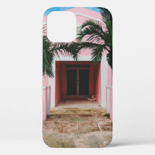 Pink and white concrete house near green trees und iPhone 12 case