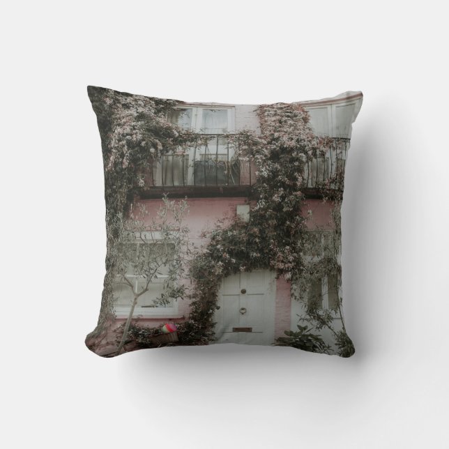 PINK AND WHITE PAINTED HOUSE COVERED WITH PLANTS A THROW PILLOW (Front)