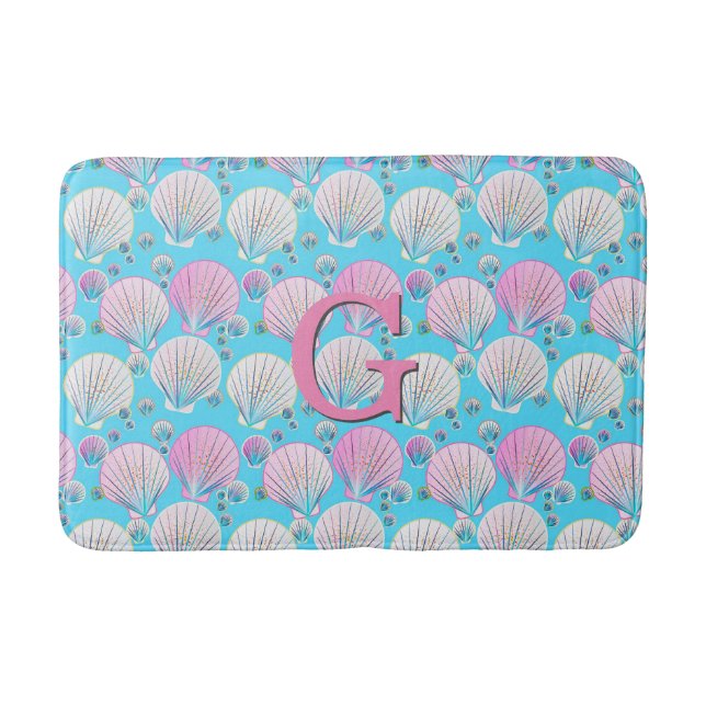 Pink and white sea shells on turquoise bathroom mat (Front)