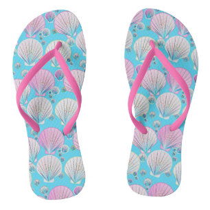 Pink and white sea shells on turquoise flip flops