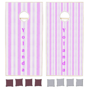 Pink and white striped print cornhole set
