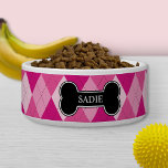 Pink Argyle Pattern With Black Bone And Name Bowl<br><div class="desc">Argyle style pattern in pink color scheme. There is also a black dog bone shaped banner with a personalizable text area for pet's name.</div>