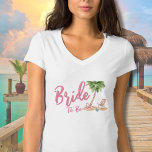 Pink Beach Bachelorette Party Bride To Be T-Shirt<br><div class="desc">Cute Pink Beach Bachelorette Party Bride T-Shirt. A cool watercolor beach theme with shades of pink and teal, setting the vibe for a beach escape with the bride and her besties. From trips to Florida, California, or even something more international like Mexico, Hawaii or The Bahamas, this girls weekend is...</div>