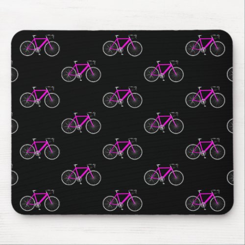 pink bicycle on black mouse pad