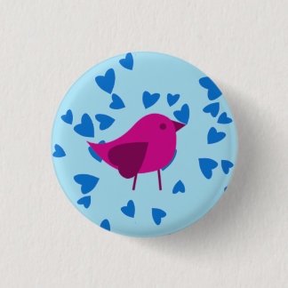 Pink bird with blue hearts button