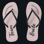 Pink Black Name Bride Bridal Party Bachelorette Flip Flops<br><div class="desc">A simple black and pink minimalist typography design for a bridal shower, bachelorette party or beach wedding. The text is customizable and can be personalized with your own name and bride slogan. For example, Bride Squad instead of Team Bride, Bride repeated on the left and right foot, or something else....</div>