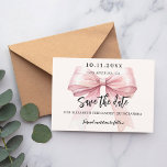 Pink bow cream Quinceanera Save the Date card<br><div class="desc">A modern and elegant Save the Date for a Quinceañera.   A soft cream,  beige colored background,  decorated with a large pink bow. Personalize and add date,  place,  name and age.</div>