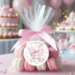 Pink Bow Pearls Quinceañera Thank you Sticker<br><div class="desc">Add a touch of elegance to your celebration with our Pink Bow Pearls Quinceañera Thank You Sticker. Featuring a delicate blush pink bow adorned with pearls, surrounded by whimsical wildflowers and graceful butterflies, this design is perfect for sealing envelopes, party favors, or gift bags. The charming Coquette-inspired theme makes it...</div>