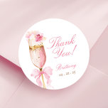 Pink Bow Petals Prosecco Bridal Shower Classic Round Sticker<br><div class="desc">Pink Bow Petals Prosecco Bridal Shower Classic Round Sticker featuring a golden and pink prosecco glass adorned with delicate pink florals and a pink bow. The design is perfect for a chic Petals and Prosecco themed brunch and bubbly celebration.</div>