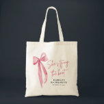 Pink Bow She's Tying the Knot Bachelorette Party Tote Bag<br><div class="desc">Celebrate in style with this Pink Bow "She’s Tying the Knot" bachelorette party tote bag 💕 Featuring a sweet pink ribbon design and playful script, it’s the perfect accessory for the bride and her crew. Great for holding party favors, weekend essentials, or wedding day must-haves! 🎀 Reusable, lightweight, and totally...</div>
