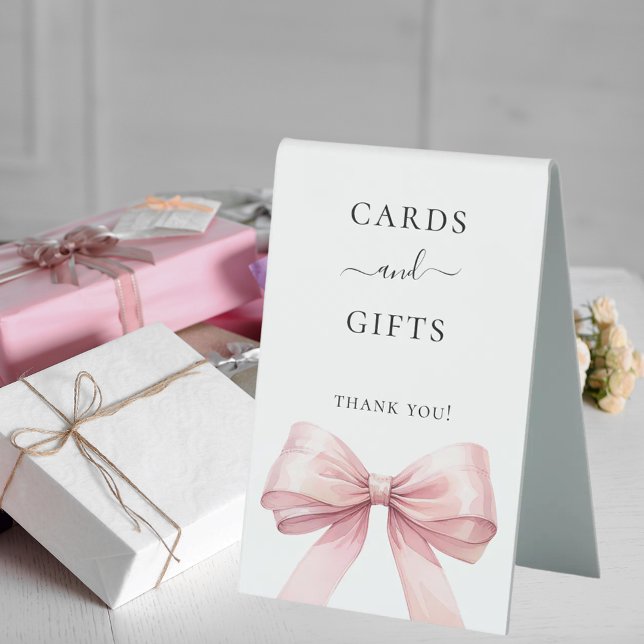 Pink bow white cards gifts sign (Creator Uploaded)