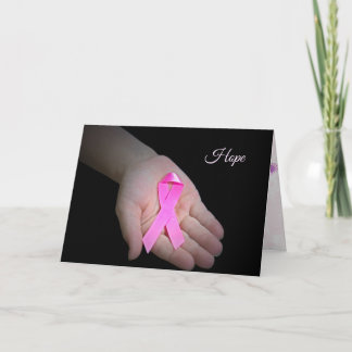 pink breast cancer ribbon in girl's hand card