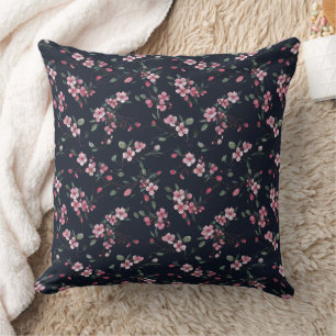 Pink cherry blossoms on a navy blue pattern throw pillow