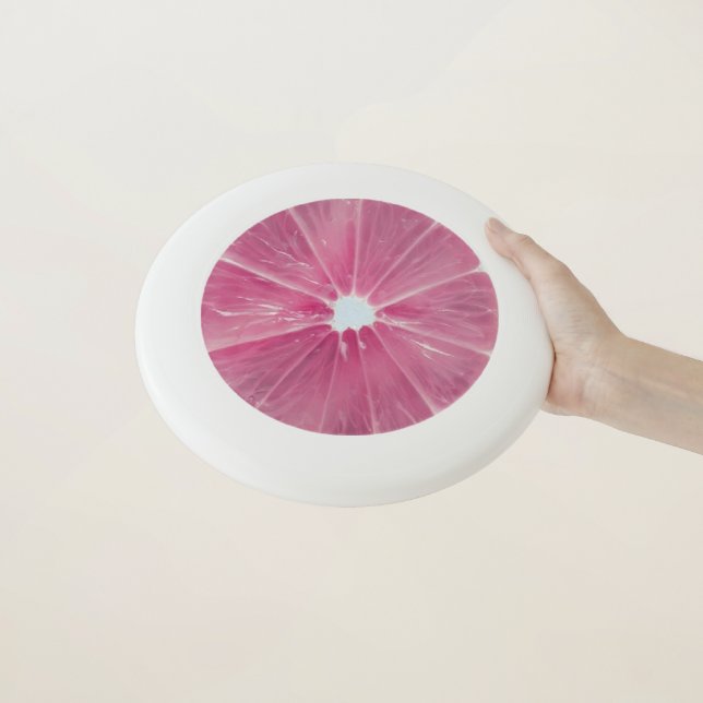 Pink citrus fruit Wham-O frisbee (In Hand)