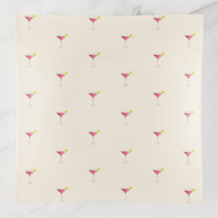 Pink cocktail with a slice of lemon trinket tray