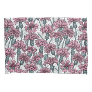 Pink cornflowers, wild flowers on white pillow case