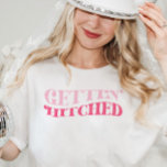 Pink Cowgirl Gettin Hitched Bachelorette Party T-Shirt<br><div class="desc">This design features a retro funky wording that says: Gettin' Hitched. Perfect for celebrating the Bride's Last Disco or Last Rodeo! See the entire collection for more matching items!</div>
