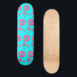 Pink cream donuts skateboard<br><div class="desc">Pink cream donuts on blue background.</div>