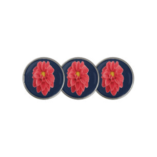 Pink dahlia flower on blue golf ball marker