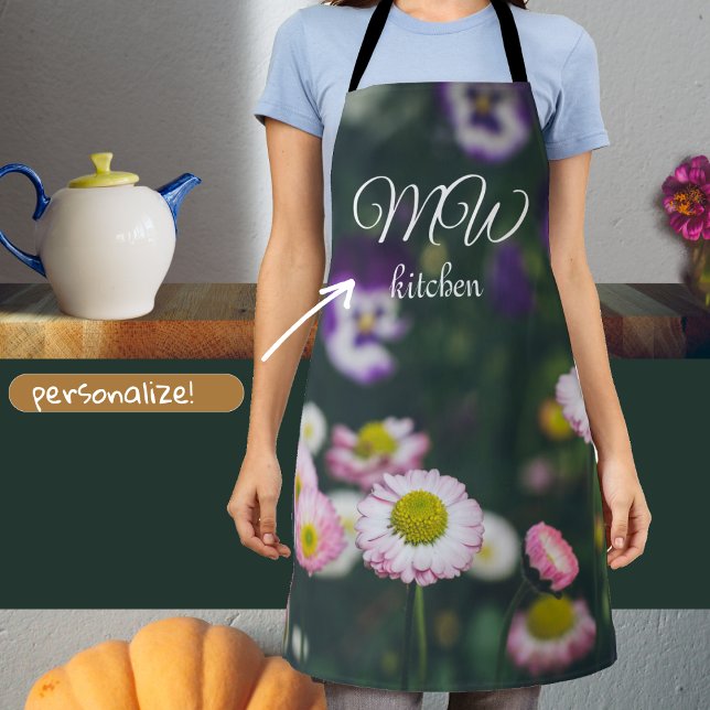 Pink daisies and pansies in the green garden apron (Creator Uploaded)