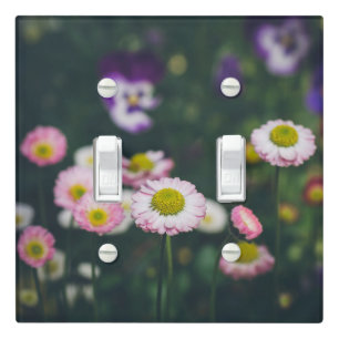 Pink daisies and pansies in the green garden light switch cover
