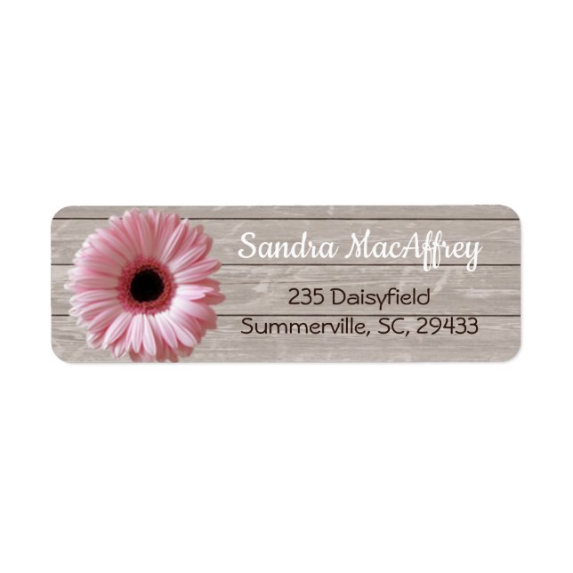 Pink daisy gerbera on light wood label (Front)