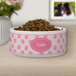 Pink Dog Paws Pattern With Custom Name Bowl<br><div class="desc">Pink dog paw print pattern with a pink badge that has a personalizable text area for the name of the pet or other custom text such as "food", "dinner" or "water" for example. The font is a lovely script font in white color. Elegant yet classy design for anyone who likes...</div>