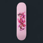 Pink Dragon and Blossoms Skateboard<br><div class="desc">a decorative design of a pink colored dragon,  lizard or serpent with pink blossoms growing from a tree branch on a lightly pink colored skateboard.</div>
