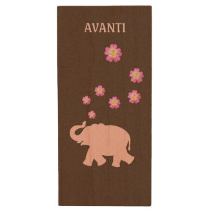 Pink elephant with pink flowers on brown wood flash drive