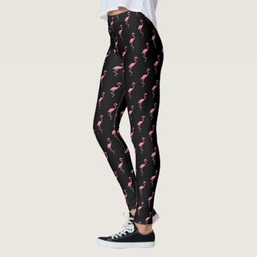 Pink flamingo illustration on black pattern leggings