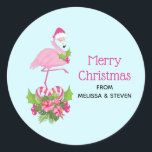 Pink Flamingo in Santa Hat Whimsical Christmas Classic Round Sticker<br><div class="desc">Stickers with a tropical themed Christmas flamingo wearing a pink santa hat. Underneath its feet is a candy cane bouquet with pretty tropical flowers and pink berries. A sprig of holly on its chest.</div>