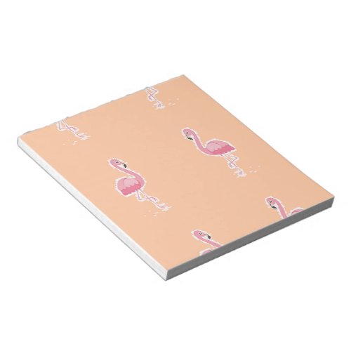 pink flamingo on pale orange notepad