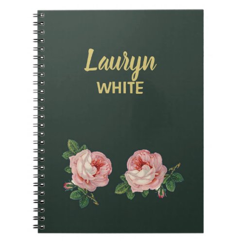 Pink flower and leaves on dark green notebook