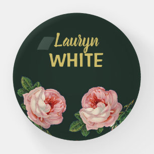 Pink flower and leaves on dark green paperweight