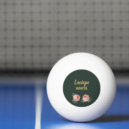 Pink flower and leaves on dark green ping pong ball