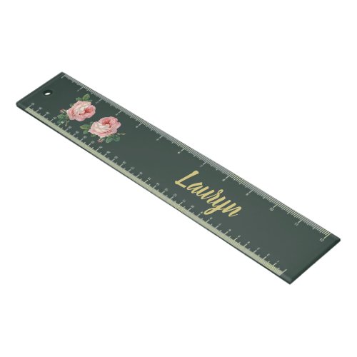 Pink flower and leaves on dark green ruler