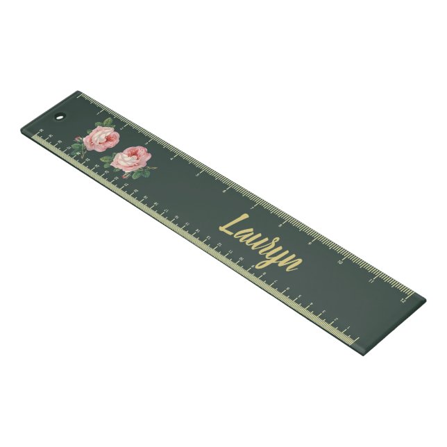 Pink flower and leaves on dark green ruler (Angled)