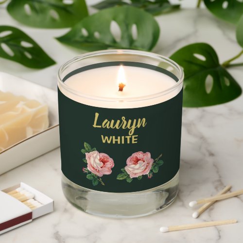 Pink flower and leaves on dark green scented candle