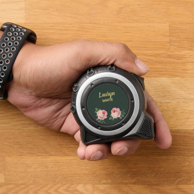 Pink flower and leaves on dark green tape measure (Home)