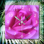 Pink flower rose photo modern stylish simple bold square wall clock<br><div class="desc">A close-up photo of a vibrant purple-pink rose makes you want to "stop and smell the flowers". Relax and inhale the beauty of this photograph whenever you check the time on this stunning, graphic photography wall clock. Your choice of a round or square clock face. Makes a great housewarming gift!...</div>