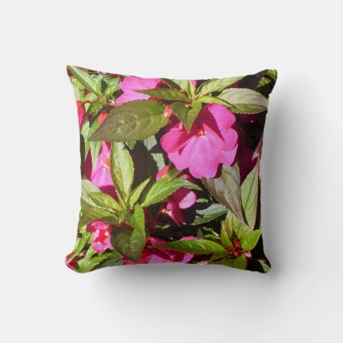 Pink flowers and green leaves throw pillow