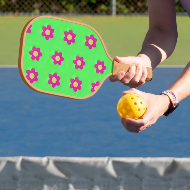 Pink flowers on green pickleball paddle (Insitu)