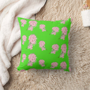 Pink flowers on green throw pillow